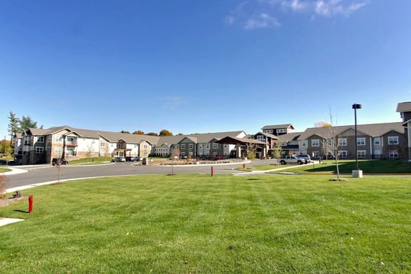Exterior view of Westchester Village of Lenexa with landscaped lawn