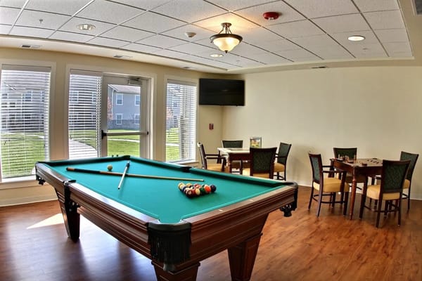Interior view of a game room with a pool table