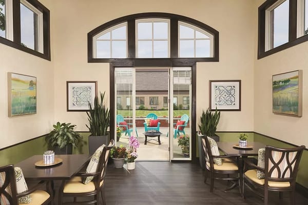 Interior view of a common area leading to an outdoor patio