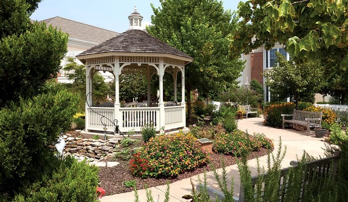 A beautifully landscaped gazebo in a garden