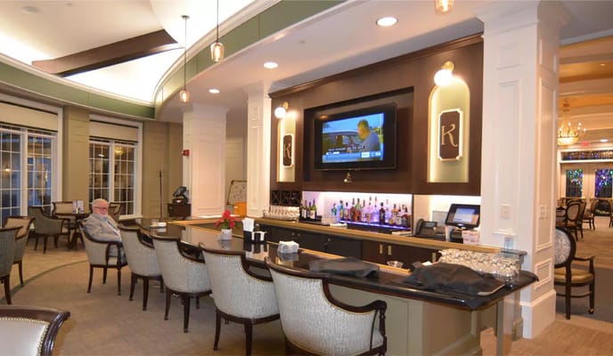 Interior common area with a resident and bar