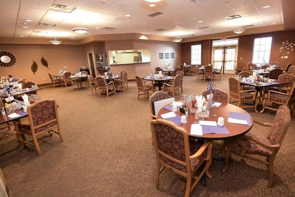 Dining room with tables and chairs set for a meal