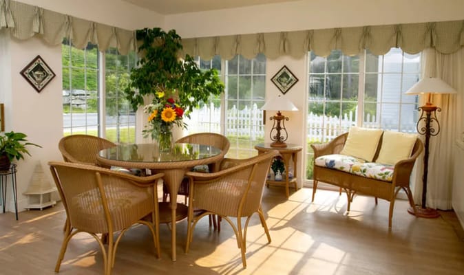 Bright common area with seating and large windows