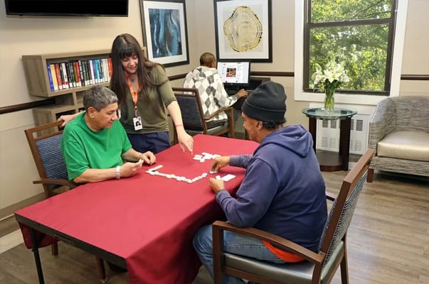Residents playing dominos in a common area