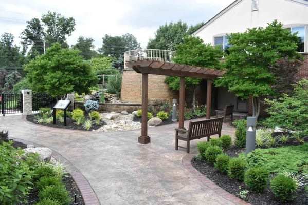 Beautiful outdoor garden area with benches and greenery