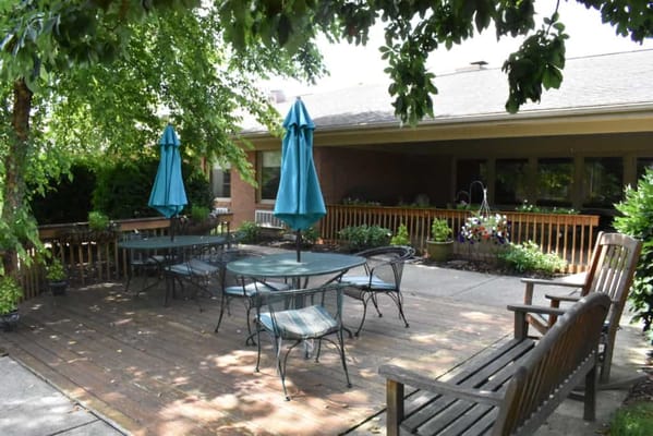 Outdoor patio area with seating and umbrellas