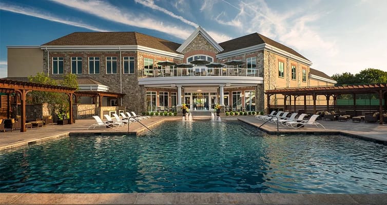 Outdoor pool view with the facility building in background