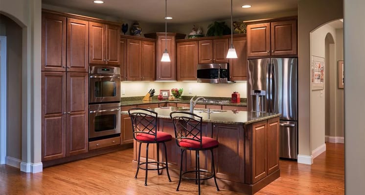 Modern kitchen with wooden cabinets and bar stools