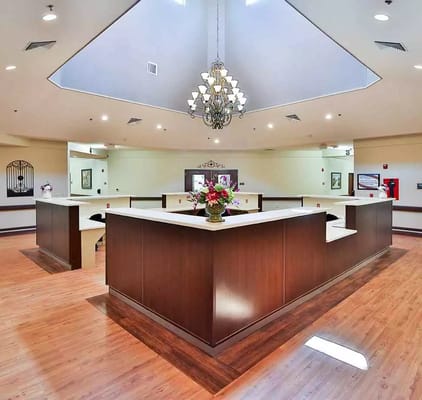Elegant lobby with a chandelier and reception area