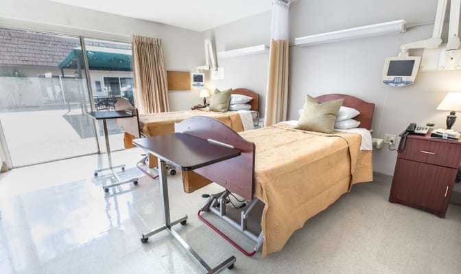 Interior view of a resident room with two beds