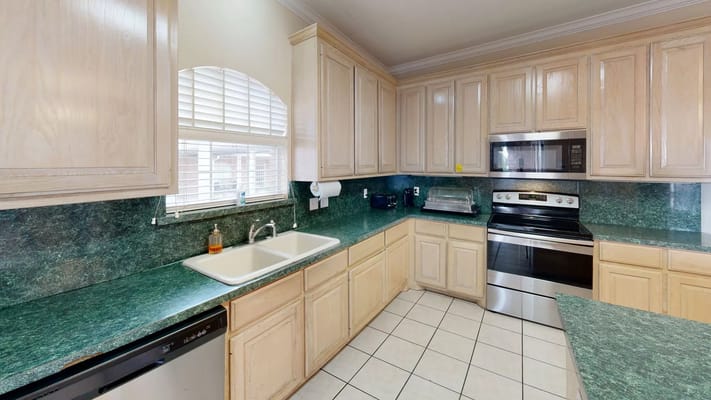 Bright kitchen area with modern appliances