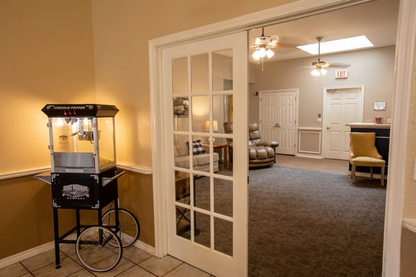 Interior view of a common area with popcorn machine