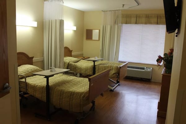 Interior view of a shared resident room with beds