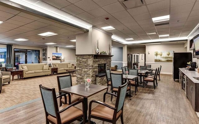 Open common area with seating and dining tables