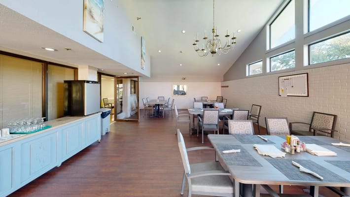 Interior view of a dining area with tables and chairs