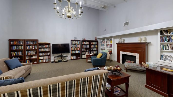 Interior common area with seating and bookshelves