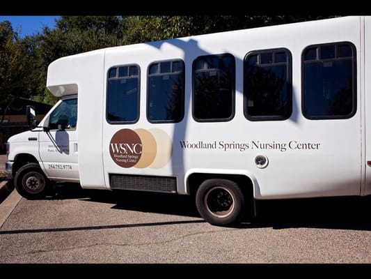 Bus for Woodland Springs Nursing Center parked