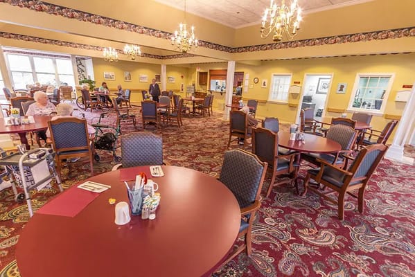 Diners enjoying a meal in a bright dining room