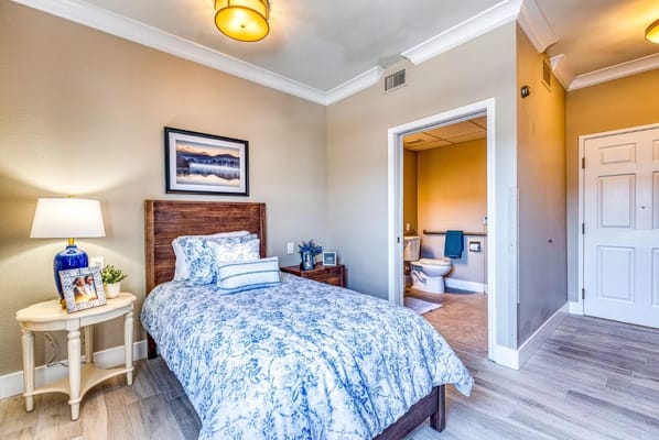 Cozy private resident room with a bed and decorative elements