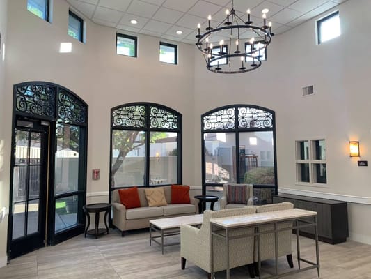 Bright common area with seating and natural light