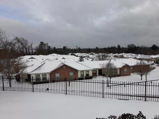 Aerial view of Woodside Manor covered in snow