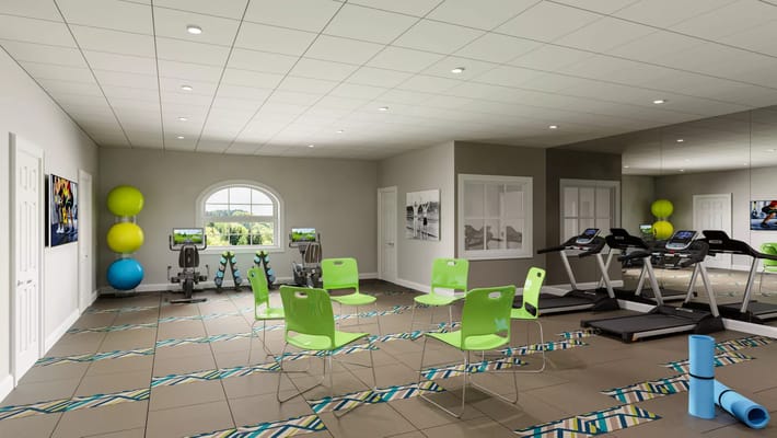 Bright gym with green chairs, exercise equipment, and colorful yoga mats.