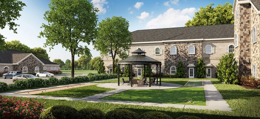 Outdoor gazebo with seating and landscaped grounds