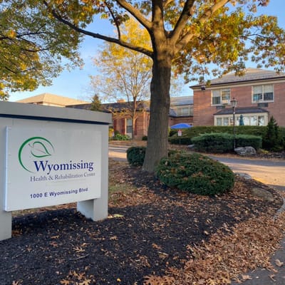 Entrance sign of Wyomissing Rehabilitation Center with trees