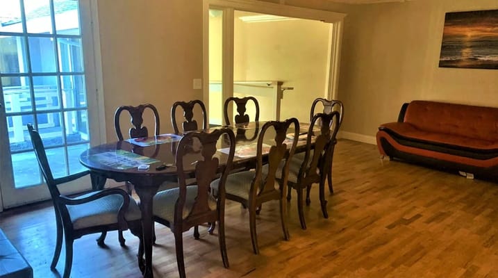 Dining area with wooden table and chairs