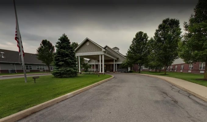 Front entrance of Seacrest Rehabilitation and Nursing Center surrounded by trees