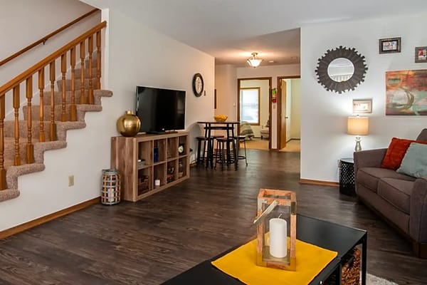 Spacious living room with a staircase and seating area