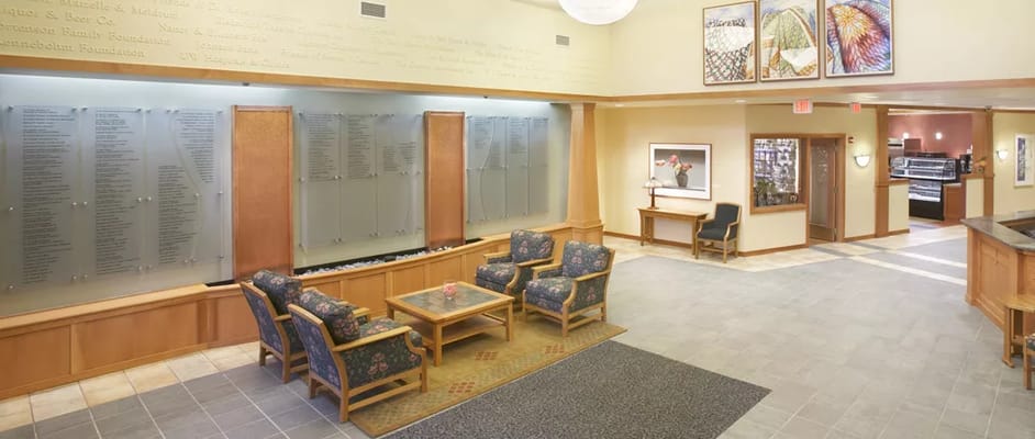 Interior common area with seating and decorative panels