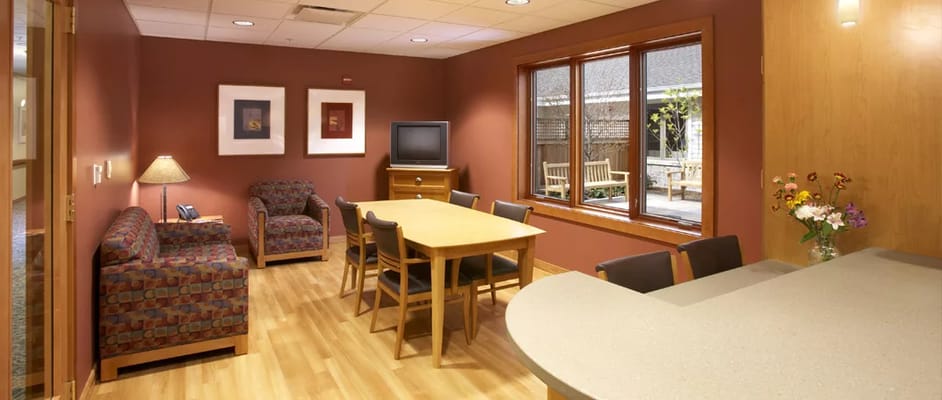 Bright lounge area with seating and a dining table