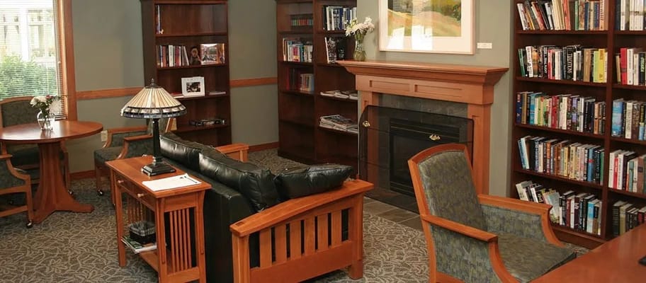 Cozy common area with bookshelves and seating
