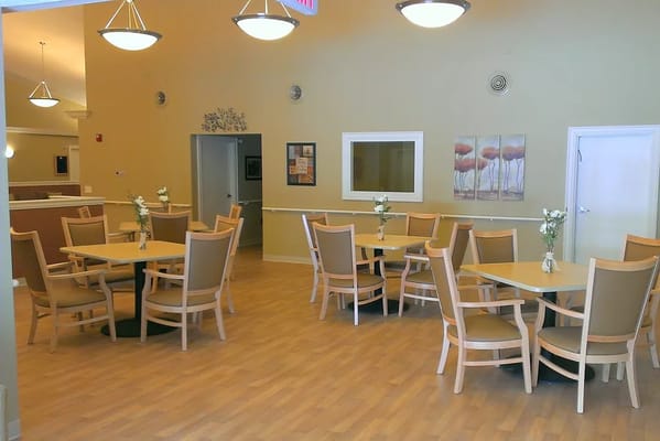 Dining area with tables and chairs in a facility
