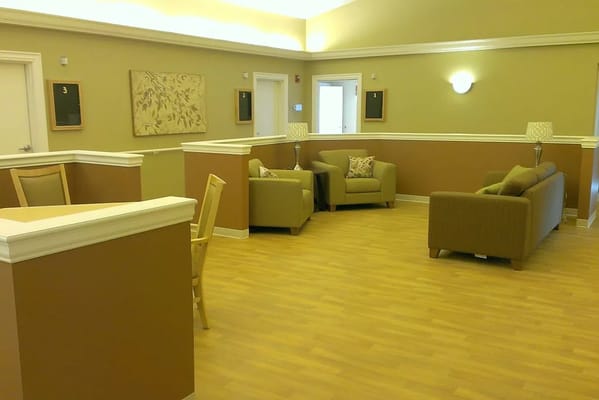 Common area seating with comfortable couches and lamps