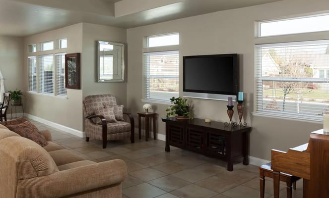 Bright and inviting common area with seating and windows