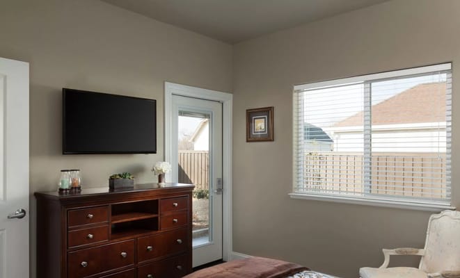 A well-furnished private resident room with natural light