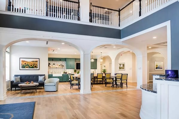 Bright common area with seating and dining space