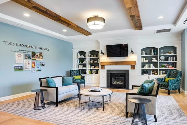 Common area with seating and decorative shelves