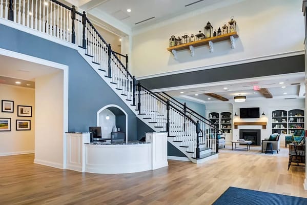 Bright interior view of a common area with a staircase