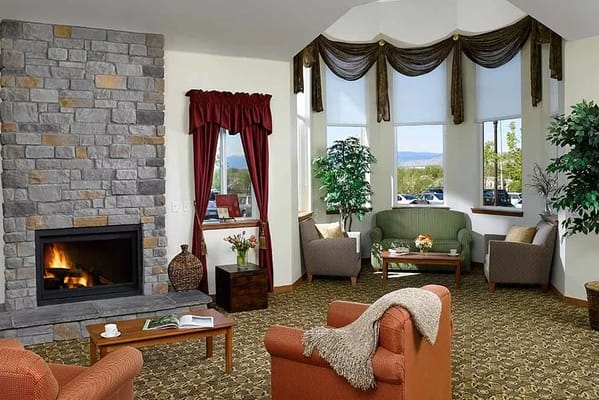 Cozy common area with seating and fireplace