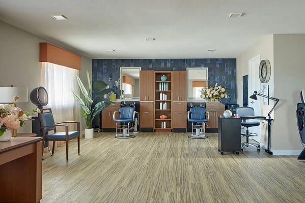 Well-lit beauty salon area with styling stations