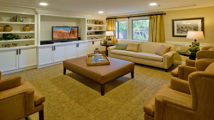 Cozy lounge area with comfortable seating and television