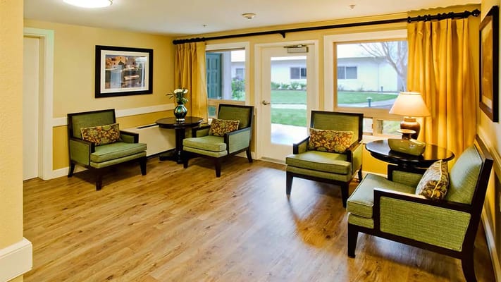 Bright common area with seating and natural light
