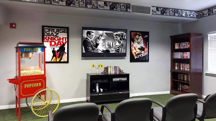 Common area with seating and a popcorn machine