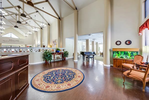 Interior view of the lobby with decorative rug and fish tank