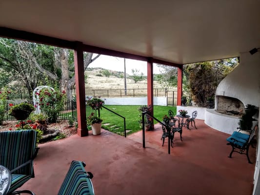 Outdoor patio area with seating and garden view