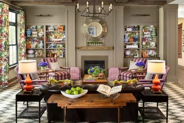 Common area with comfortable seating and decorative shelves