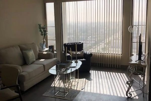 Bright living room with city view and sunlight